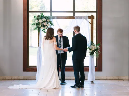 Bride and Groom Ceremony Under Altar Arch
