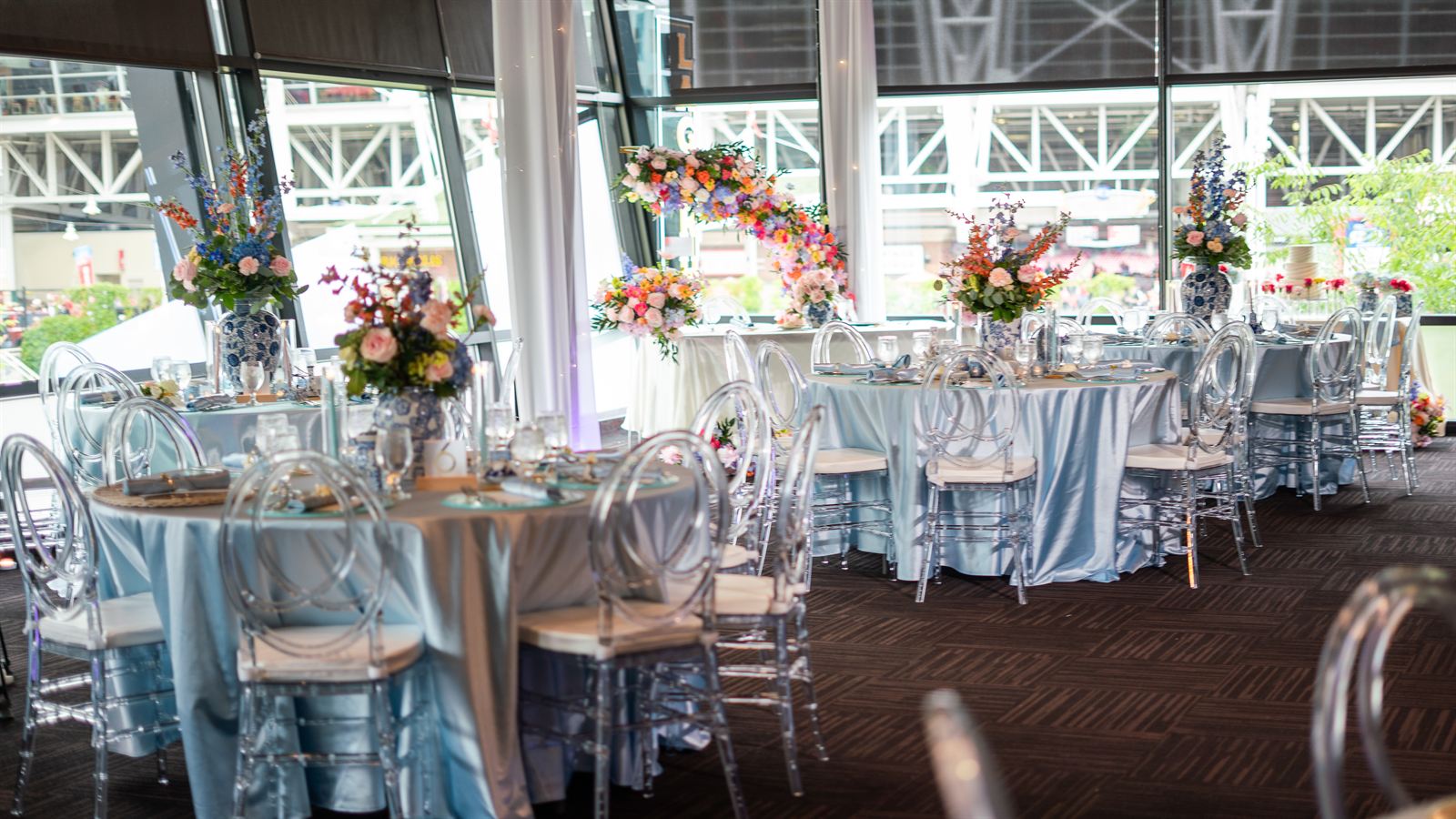 Elegant Reception Hall Table Setups with Blue Tablecloths